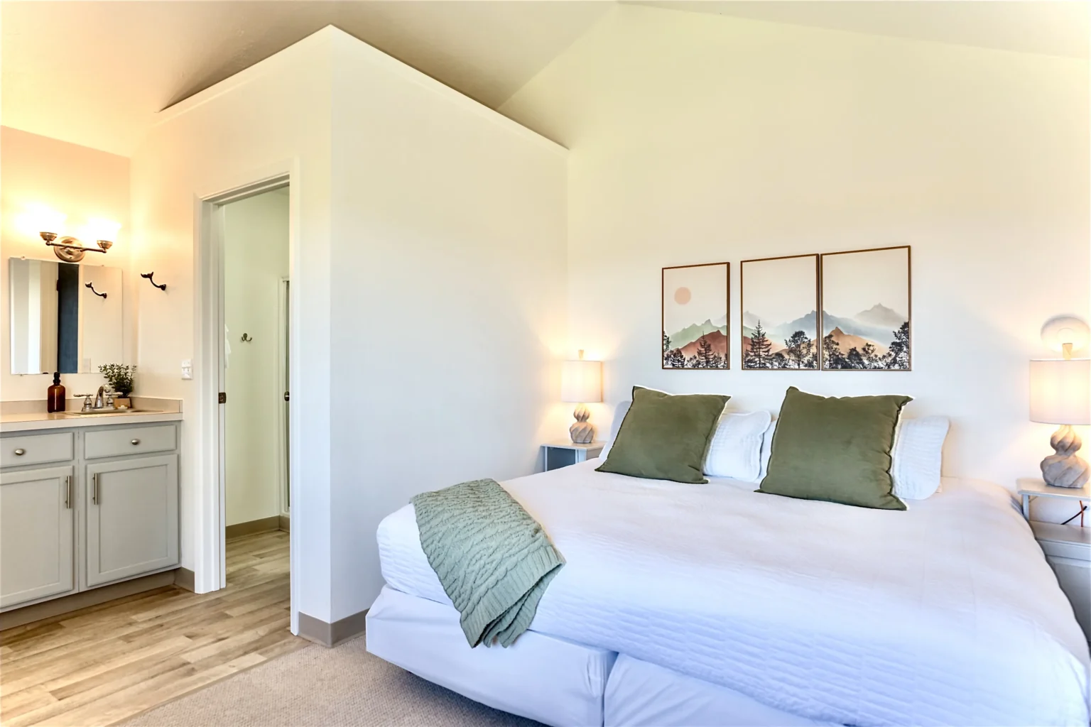 Wildflower Ridge cabin bedroom with king bed and mountain artwork